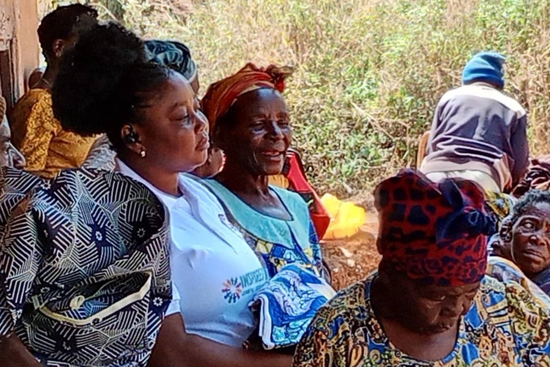 Community members gathered at an IWO outreach event